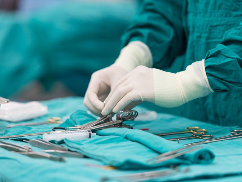 37468180 - scrub nurse preparing medical instruments for operation