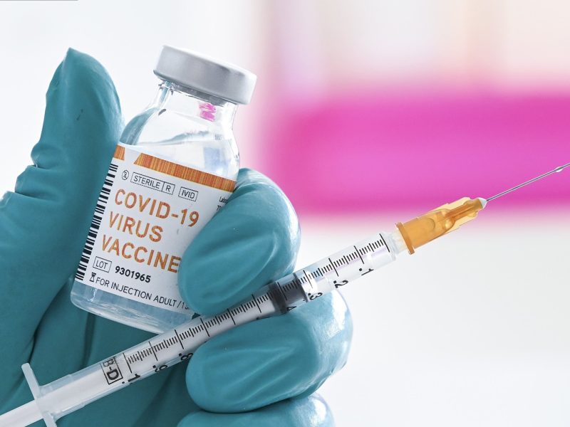BRUSSELS, BELGIUM - JUNE 18 : In this illustration a doctor holds a syringe and a bottle labelled as the Covid-19 coronavirus vaccine. At least 8,000,202 cases of infection, including 435,176 deaths, were recorded in total, particularly in Europe, the continent most affected with 2,417,902 cases (188,085 deaths) and in the United States, which has the highest number of cases (2,110,182) and deaths (116,081). There are about a hundred projects for vaccines against Covid-19, of which about ten are in the clinical trial phase. Pictured on June 18, 2020 in Brussels, Belgium, 18/06/2020 ( Photo by Vincent Kalut / Photonews via Getty Images)